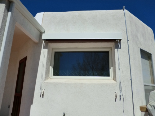 Vertical Roll Curtain with exterior hood and side cables - Rader Awning
